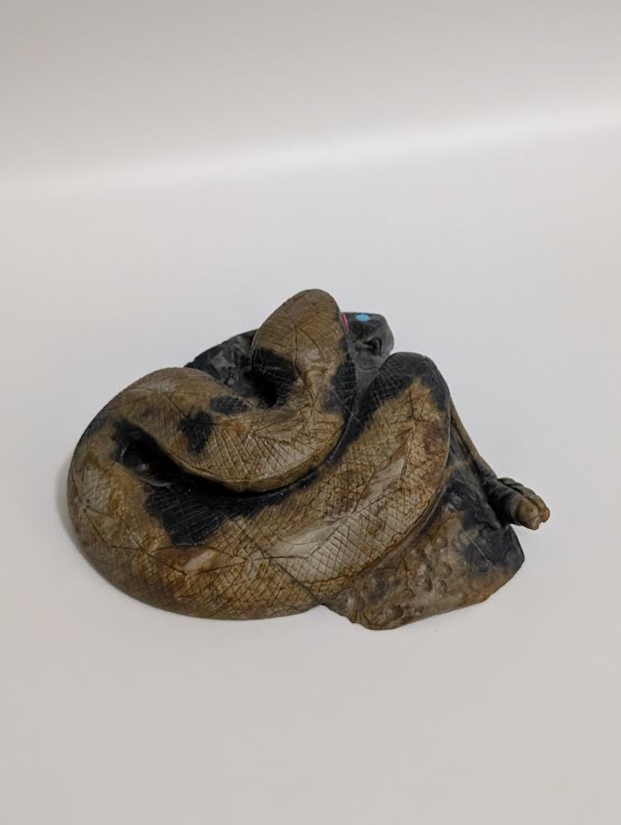 Rattle Snake eating Mouse